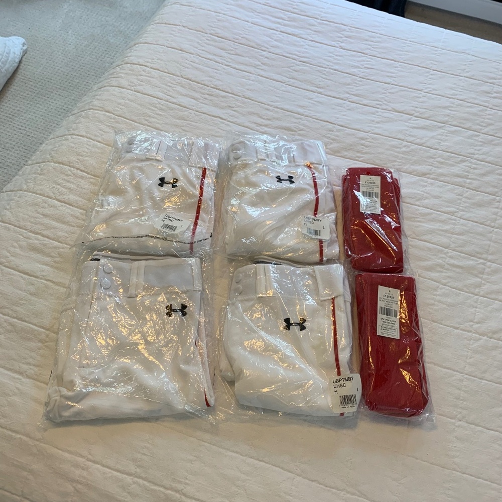 Bundle set of 4 boys baseball pants with red stripe and 2 pairs of red socks.